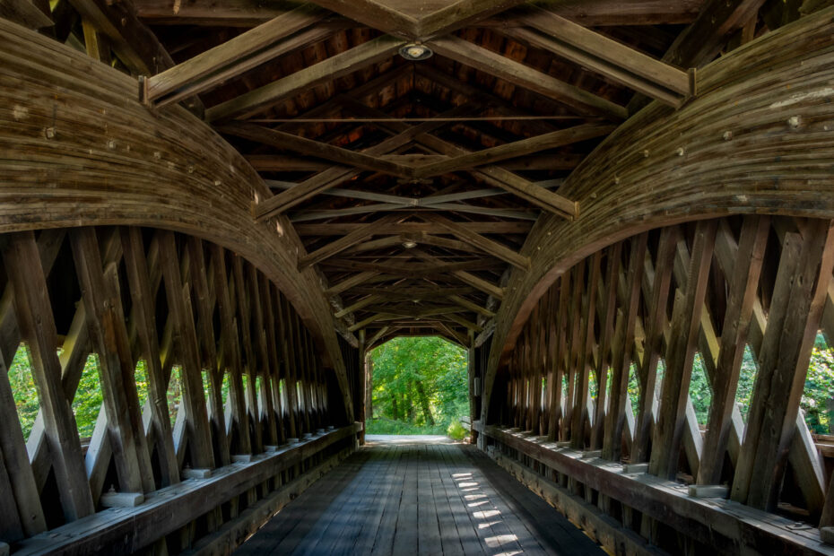 Interior of covered bridge showing elaborate woodwork